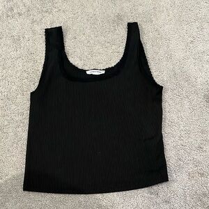 Black crop top with lace trim around sleeves. Worn once.